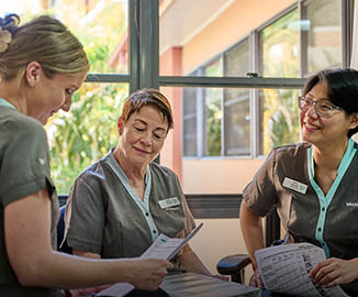 Whiddon enrolled nurses discussing plan for the day