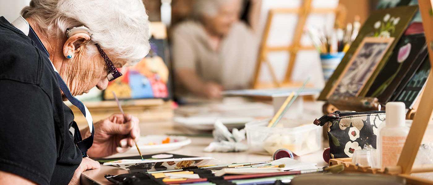 A resident painting as part of Whiddon's award-winning creative ageing program.