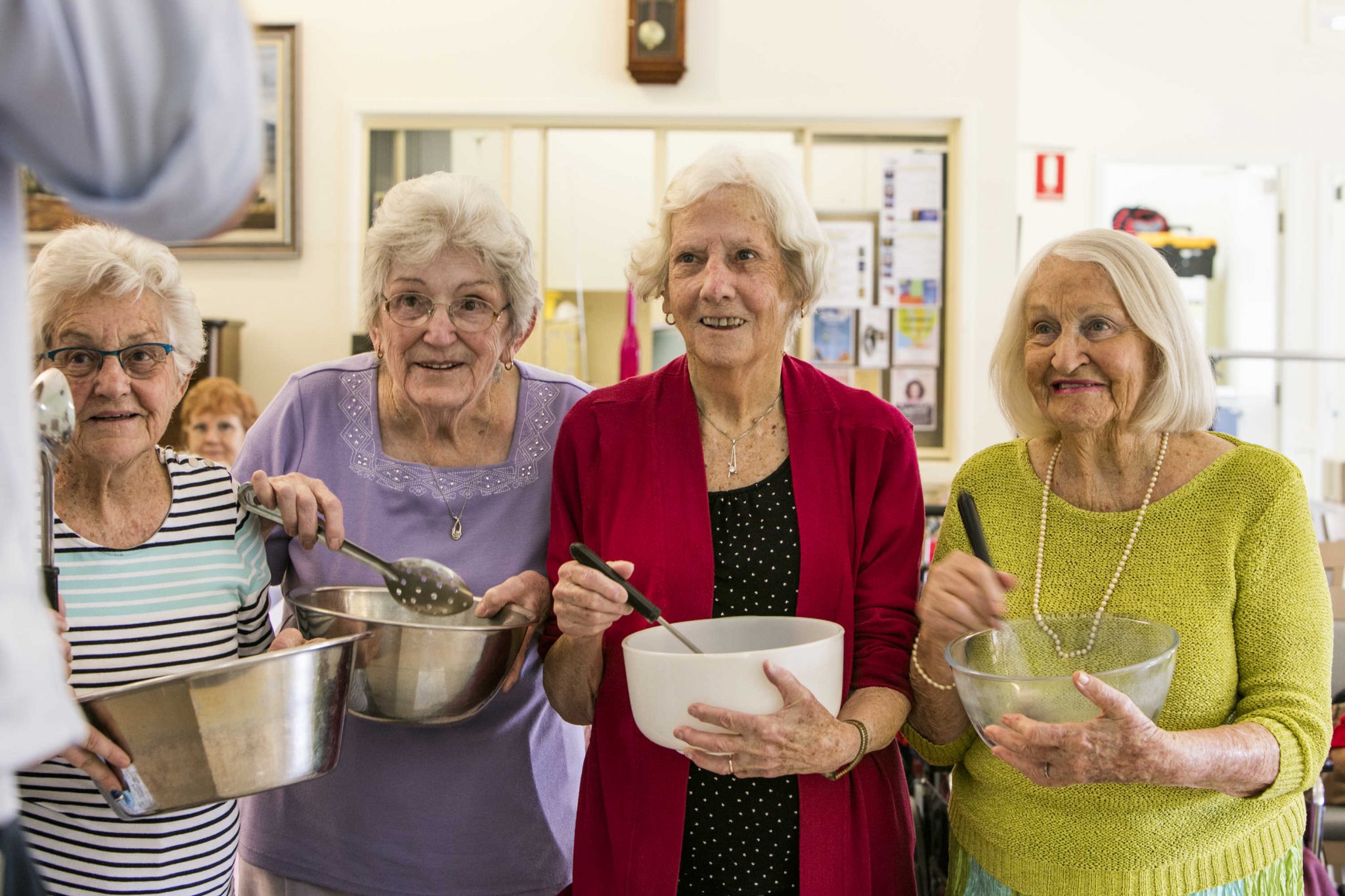 A group of residents enjoying cooking together at The Cooking Club, a creative cooking program developed by Whiddon.
