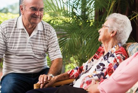 A resident couple lovingly looking at each other at Whiddon's aged care home near Wagga Wagga.