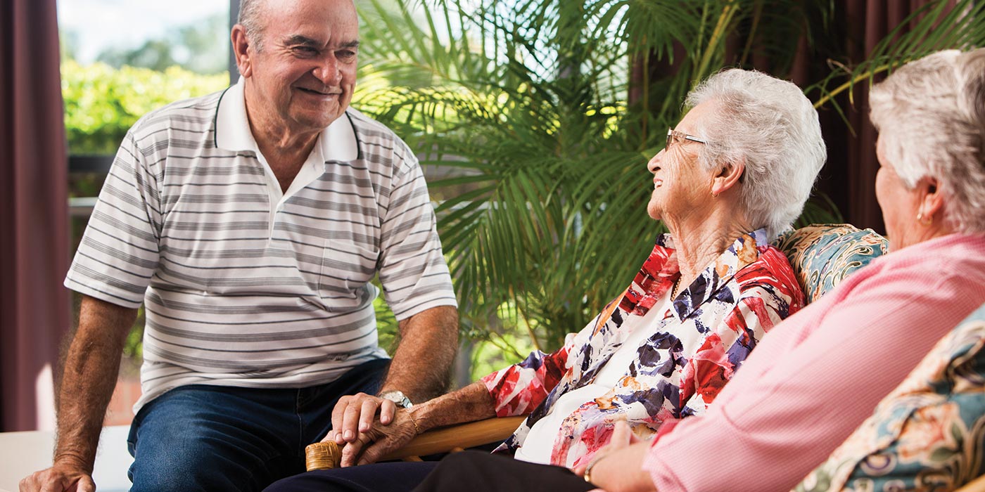 A resident couple lovingly looking at each other at Whiddon's aged care home near Wagga Wagga.