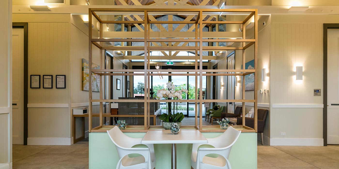 The moodern reception area of Whiddon Kelso's retirement village, fitted with warm lighting.