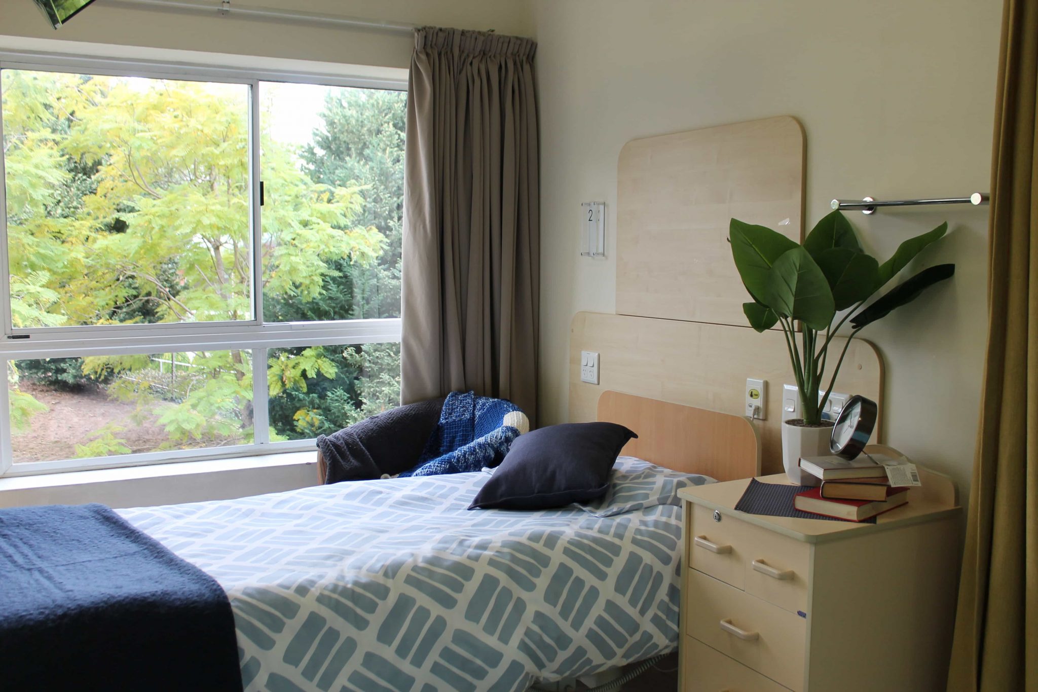 A single bedroom unit at Raines House in Whiddon Easton Park, with views of lush greenery.