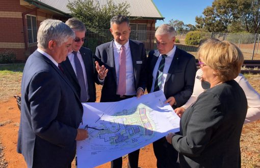 Deputy Prime Minister and Aged Care Minister looking at some building plans at Whiddon Temora.