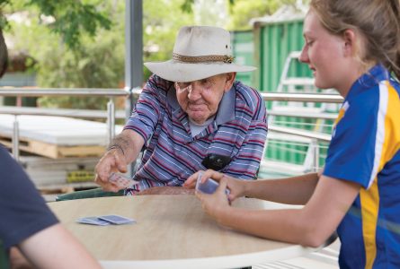Whiddon resident playing cards at an aged care home in Beaudesert.