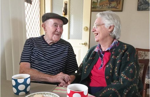 Two residents chatting over tea during Whiddon's celebration of Neighbour Day.