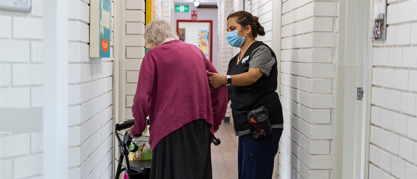 Care worker helping a lady with disability at home