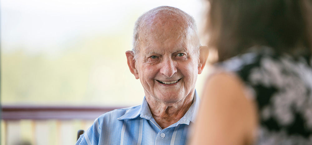 Whiddon Community Care Worker chatting with client