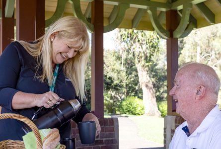 Whiddon community care worker having a picnic with client