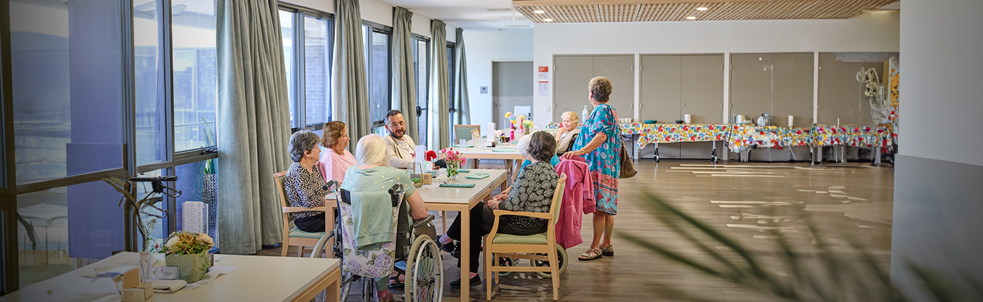 residents enjoying a meal together
