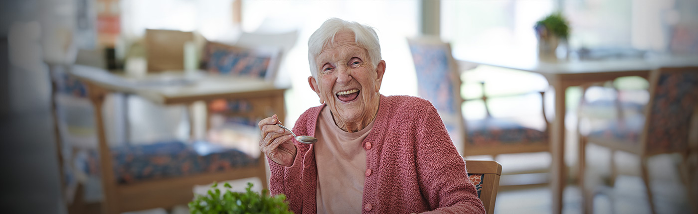 female resident enjoying activities