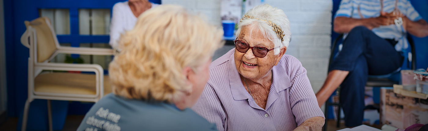 resident connecting and smiling with care worker
