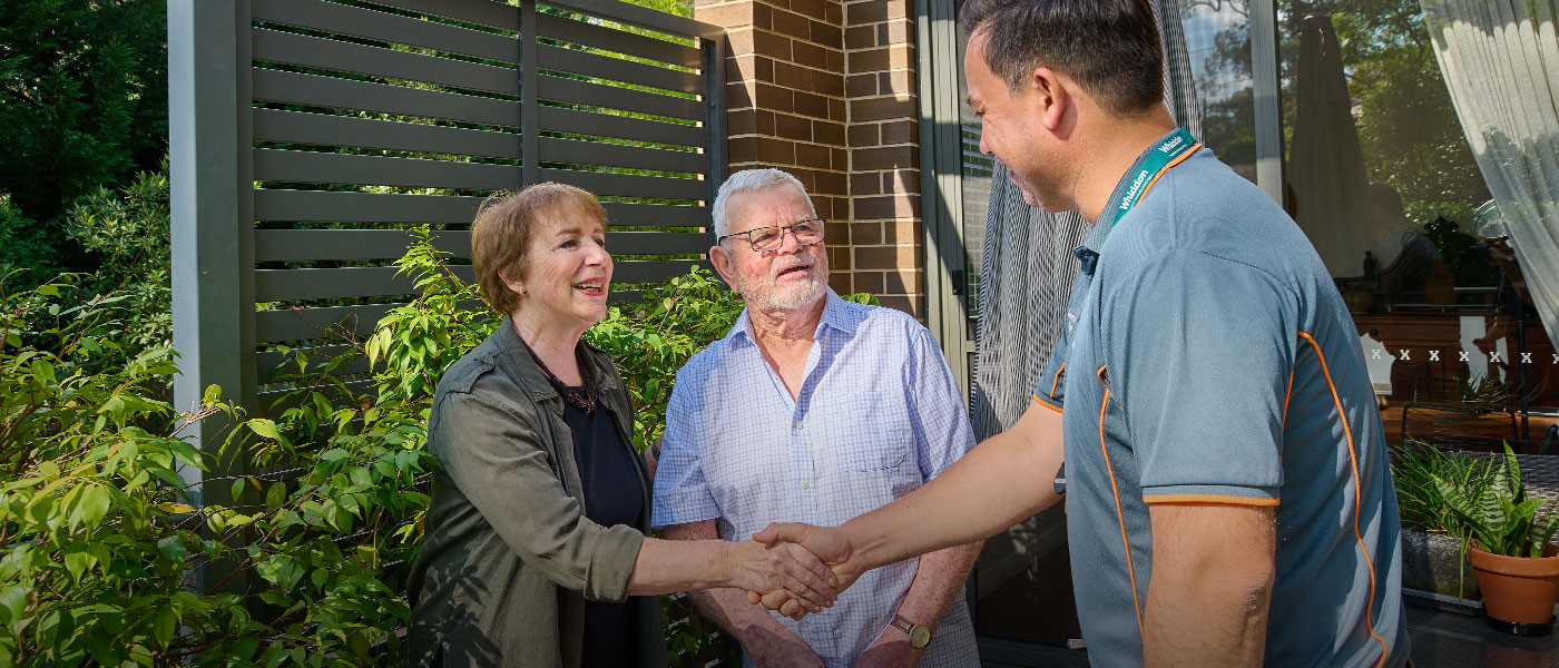 Community Care Employee greets the clients