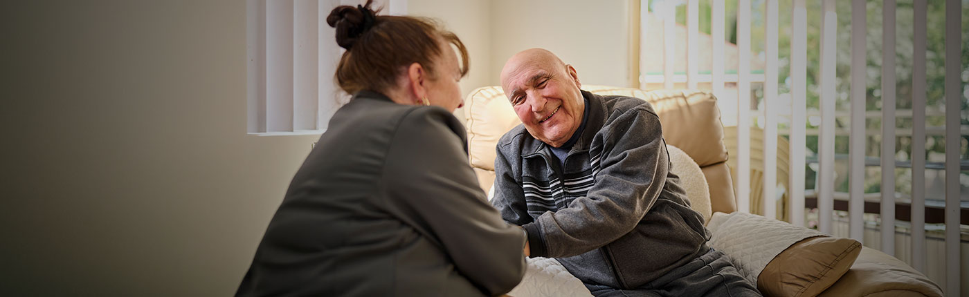 Home Care employee talks to an elderly client