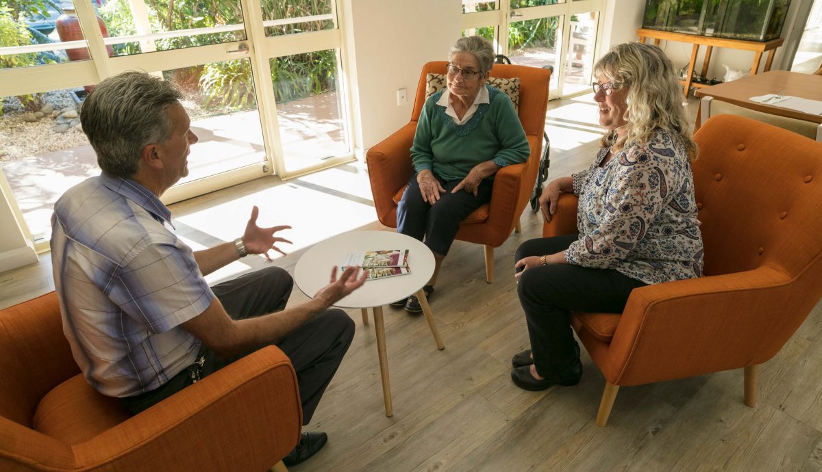 A staff member taking some guests on a tour of one of Whiddon's aged care homes.
