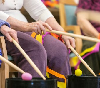 Residents happily playing some drums together at Whiddon's nursing home in Belmont.