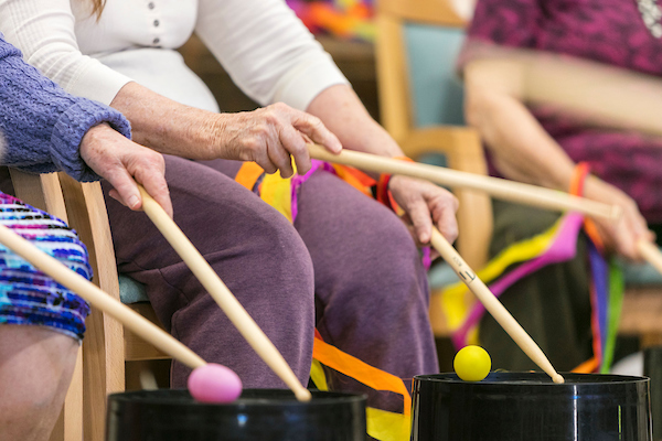 Residents happily playing some drums together at Whiddon's nursing home in Belmont.