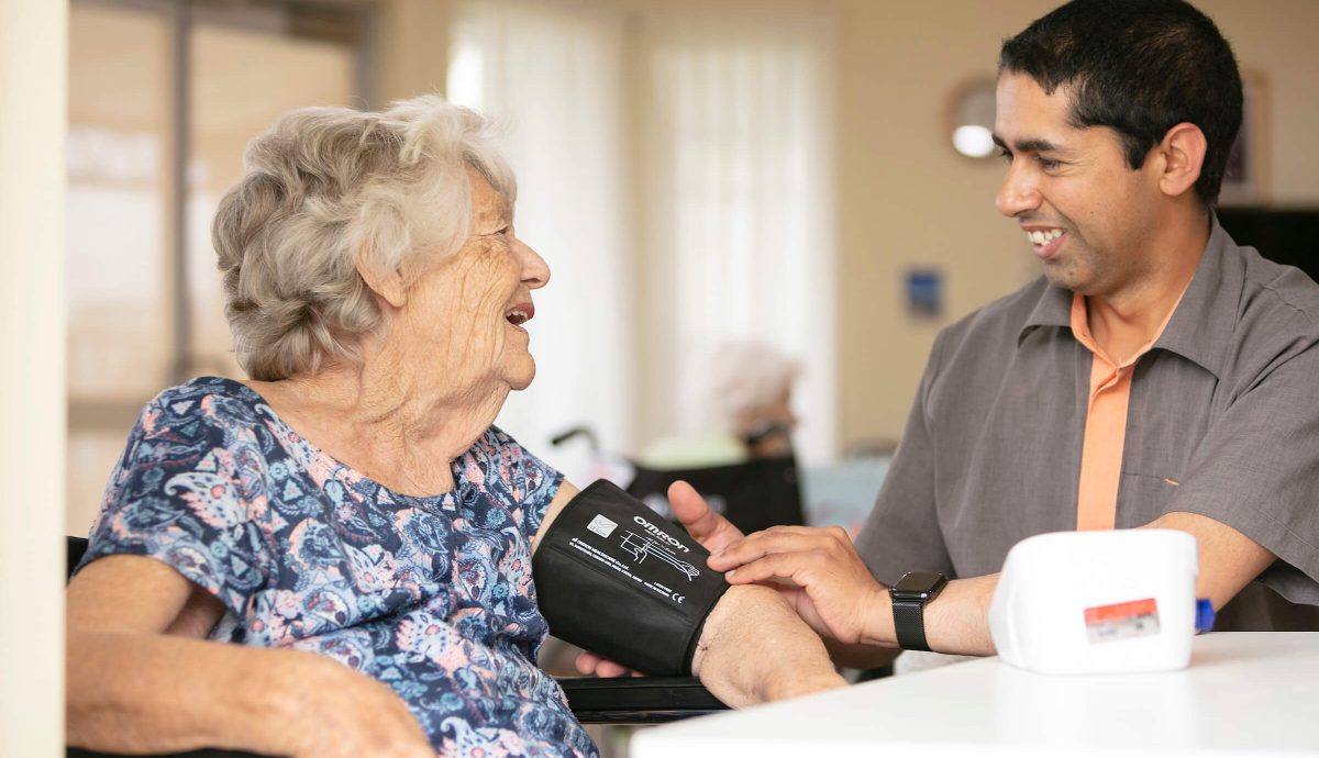 older lady living at home being supported by carer