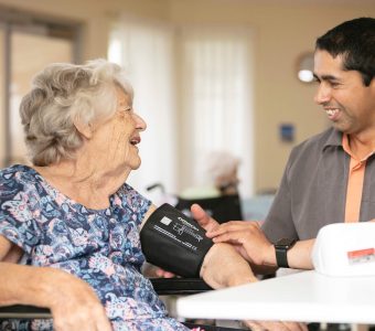 older lady living at home being supported by carer