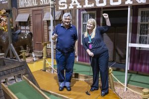 Participant, Michael is on an outing with his carer, Donna, playing a round of mini golf