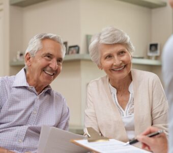 older couple meeting with advisor to discuss home care plans