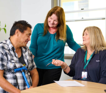 ndis particpant talking to two disability support workers