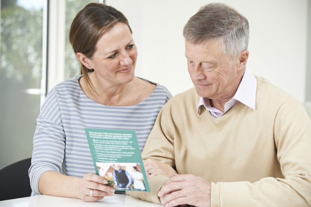 woman talking with older man about aged care