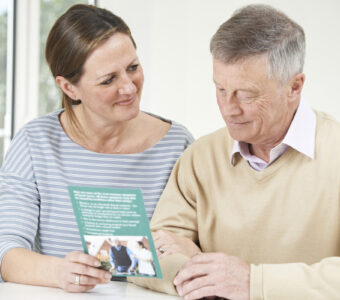 woman talking with older man about aged care