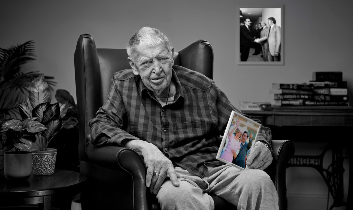 bill kerr from more to me campaign holding up picture of princess diana and prince charles