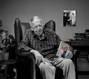 bill kerr from more to me campaign holding up picture of princess diana and prince charles