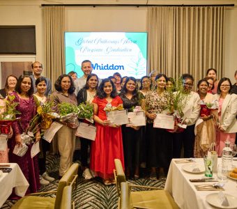 group of aged care nurse graduates standing with awards with Whiddon CEO Chris Mamarelis
